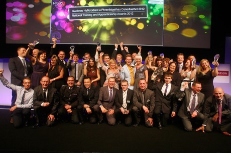 Wales Deputy Minister for Skills, Jeff Cuthbert (centre), celebrates with winners at the National Training and Apprenticeship Awards 2012