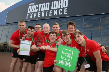 From left to right: Karl Strangeward-Morgan, Tom Parsons, Ben Johns, Jonathon Brittan, Craig Tiley, Joel Kelly, Jacob Watkins, Josh Corbett and Craig Lawrence celebrate winning the People’s Prize at the Wales National Final of the Money for Life Challenge at the Dr Who Experience in Cardiff.