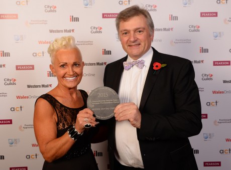 Bridge Dental Care’s principal dentist Len Smart with practice manager Sue Pipe and the award.
