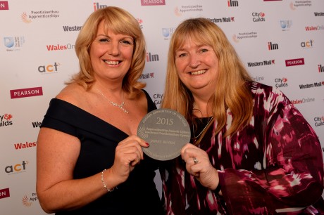 Janet Bevan (left) receives her award from Deputy Minister for Skills and Technology Julie James.