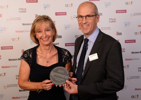 Mitel’s director of services Cenydd Burden with services manager Liz Watts and the award.