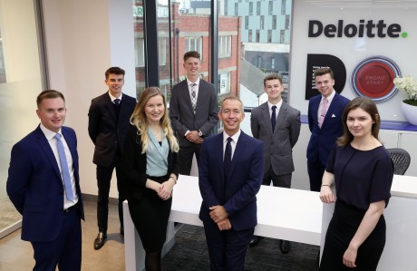 Ross Flanigan, managing director of Deloitte’s Shared Service Organisation at Cardiff Delivery Centre, with apprentices.
