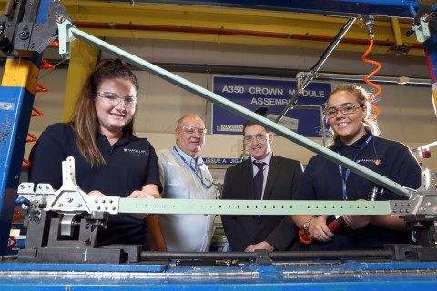 Magellan Aerospace’s training and development officer Dave Evans (centre) with apprentices Natasha Hawes and Charlotte Booth and Coleg Cambria's Peter Jones.