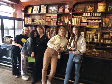 Students standing by shop counter