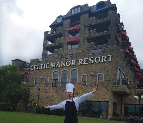 Apprentice Daniel standing outside the Celtic Manor Resort in his chef's whites