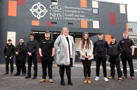Emma Bendle, apprenticeship and widening access co¬-ordinator (centre) and staff and apprentices at Cardiff and Vale University Health Board.