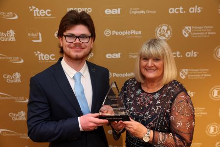 Gwynfor Jones receives the Foundation Apprentice of the Year award from sponsor, Nicola Thornton-Scott of NPTC Group of Colleges.