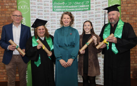 Faith O'Brien and the 4 members of staff who graduated wearing their robes.